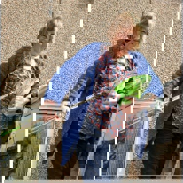 Cats Protection volunteer saving a kitten with fishing net